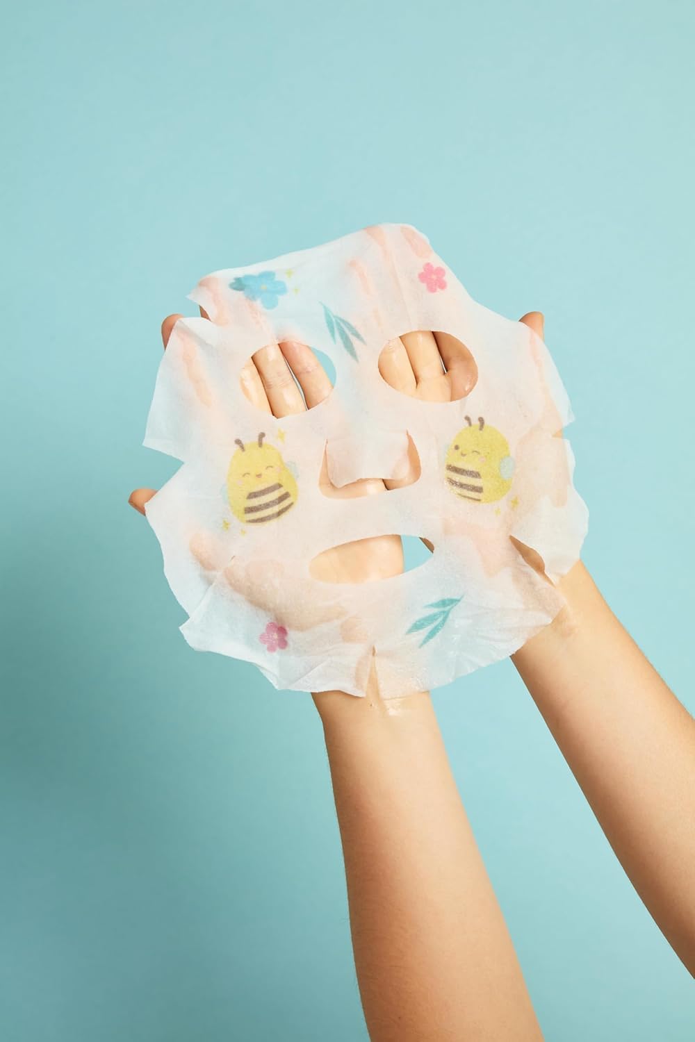TONYMOLY applied sheet mask on face demonstrating coverage and soothing treatment benefit