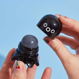 TONYMOLY close-up of balm-to-gel texture highlighting charcoal and exfoliating beads