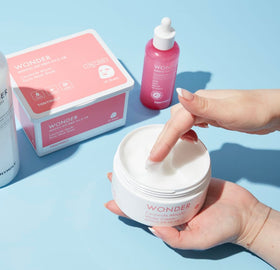 TONYMOLY jar beside a coin to display compact travel-friendly size