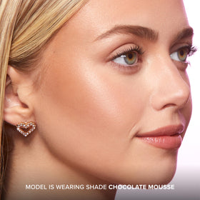 Too Faced Chocolate Soleil being applied to cheek showing natural sculpting and warmth