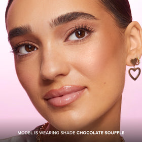 Too Faced Chocolate Soleil inside a makeup bag showing portable design and on-the-go sculpting benefit
