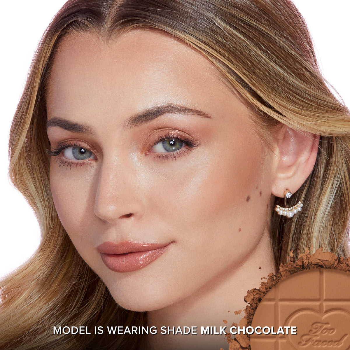 Too Faced swatches on arm showing buildable color payoff and natural warmth