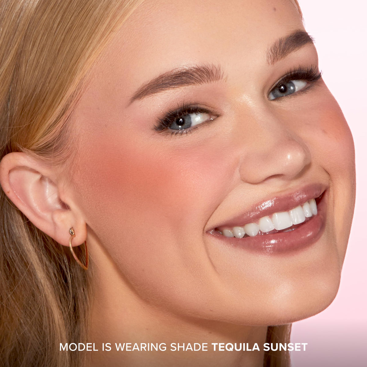 Too Faced brush picking up blush demonstrating easy blendability