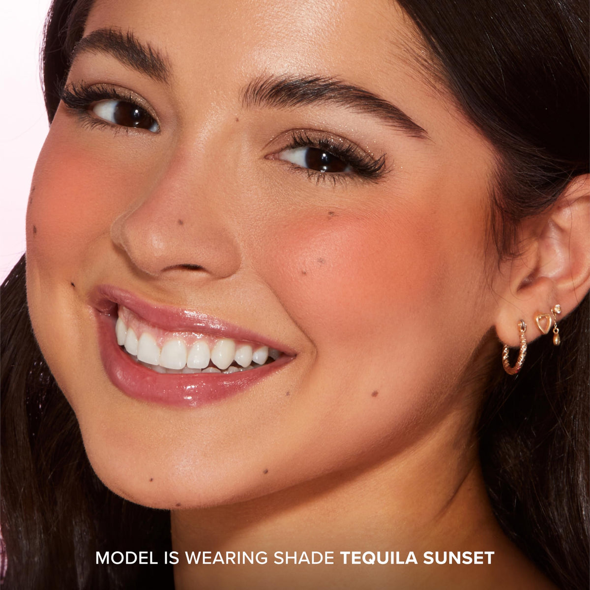 Too Faced model wearing blush for natural flushed-cheek effect