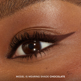 Too Faced Killer Liner held in hand for size comparison, communicating travel-friendly convenience