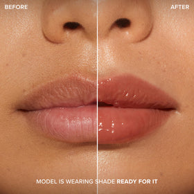 Too Faced gloss in a handbag lifestyle shot for on-the-go shine boost