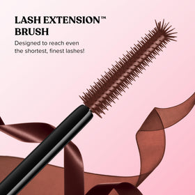 Too Faced mascara next to coin showing compact travel-friendly size