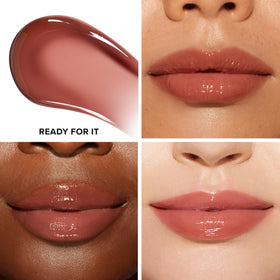 Too Faced wand applying gloss demonstrating even coverage and ease of use
