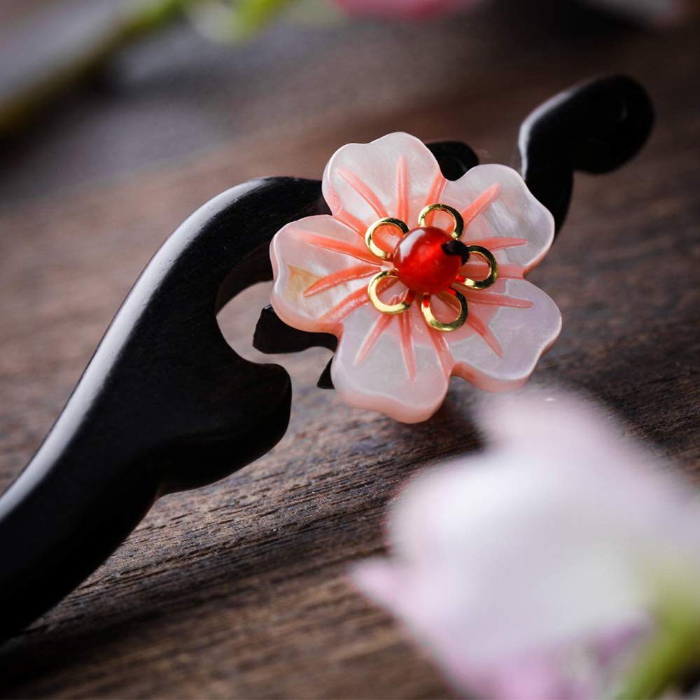 TOP SEWING hair stick worn in a bun demonstrating stability and retro style