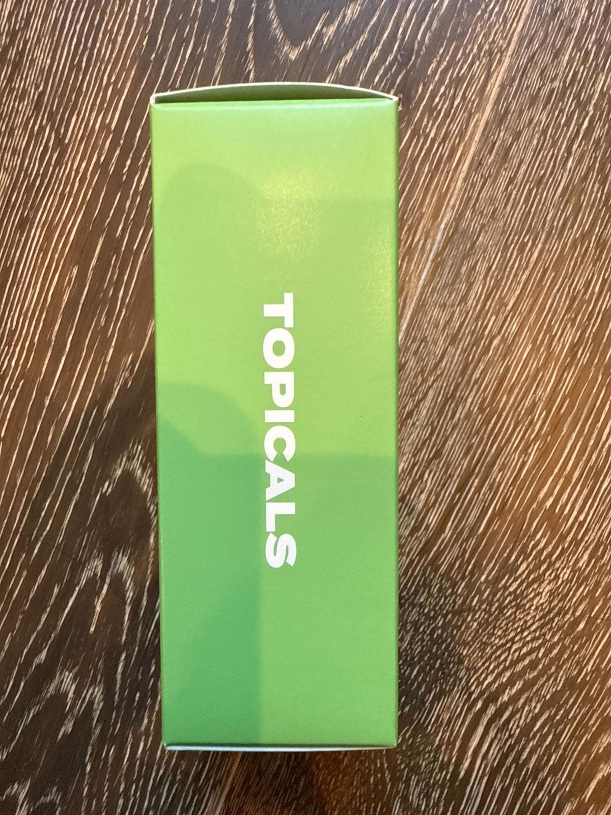 Topicals being misted on face showing gentle application and reduced redness benefit