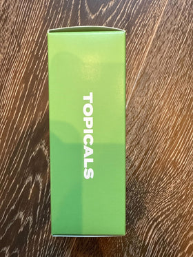 Topicals being misted on face showing gentle application and reduced redness benefit