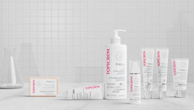 Topicrem bottle on bathroom shelf in lifestyle setting suggesting daily routine comfort