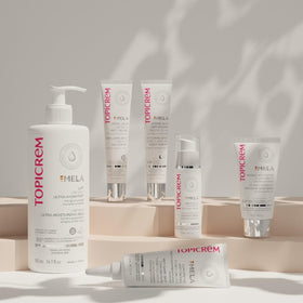 Topicrem milk texture close-up showing fluid non-greasy cream absorbing fast