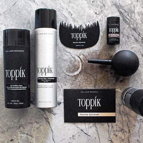 TOPPIK on a bathroom vanity staged with grooming items showing easy daily use