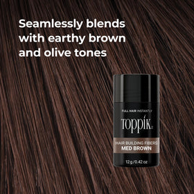 Applying Toppik to roots demonstrating discreet touch-up benefit