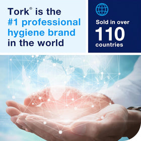 Tork extra mild beside sink in washroom scene showing professional, fragrance-free choice