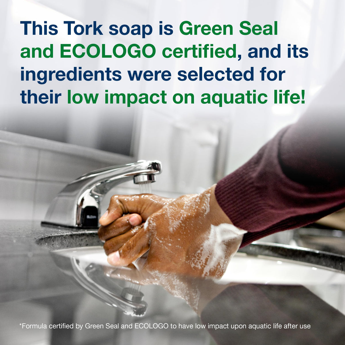 Tork extra mild held in hand for scale showing 1L size and workplace suitability