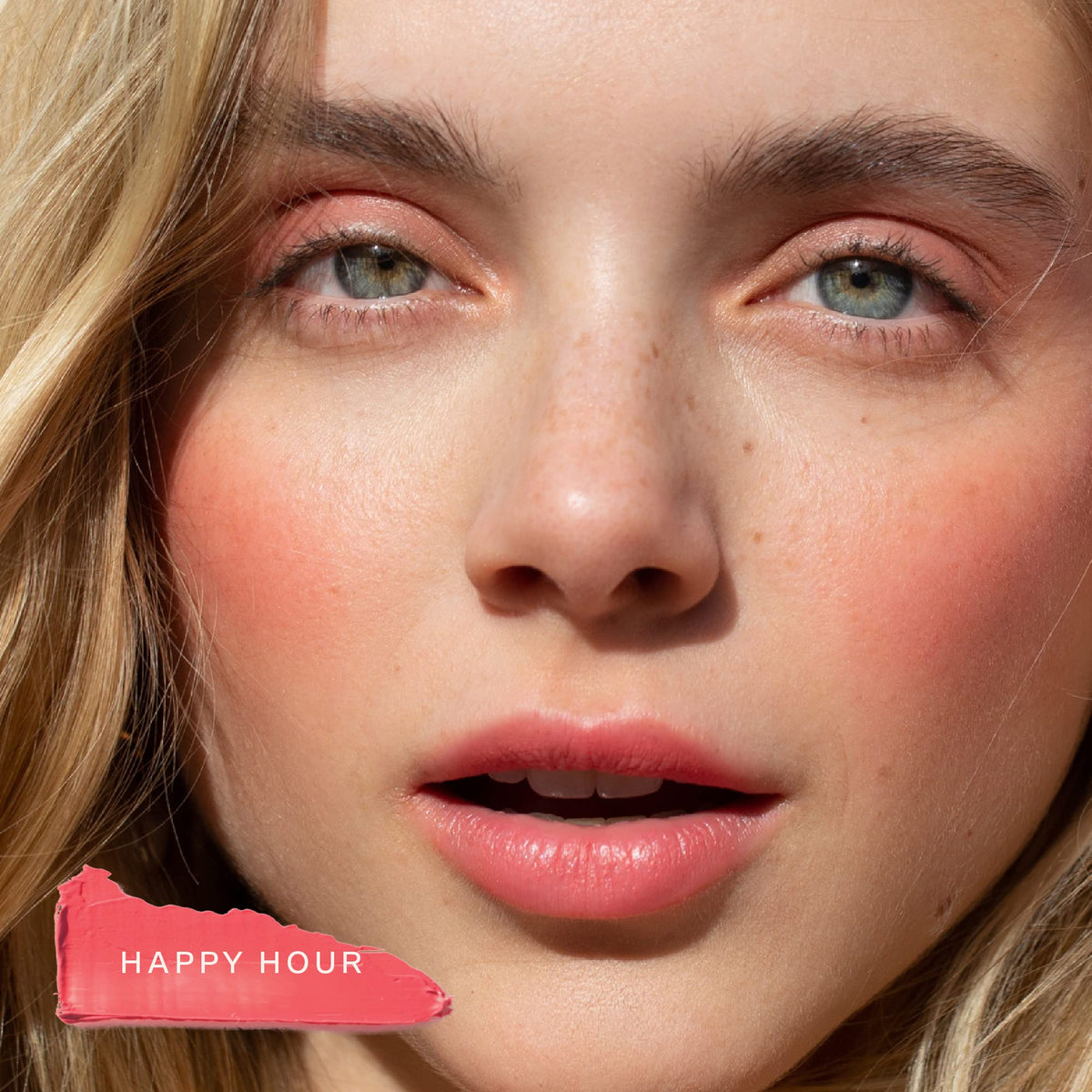 Tower 28 on lips close shot showing glossy coral tint benefit: hydrating lip color