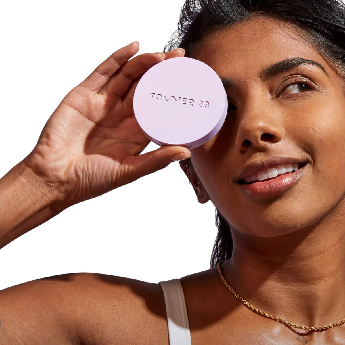 Tower 28 powder puff detail emphasizing gentle application and precision