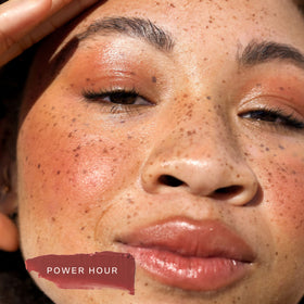 Tower 28 lip application closeup showing juicy tint and hydrating appearance