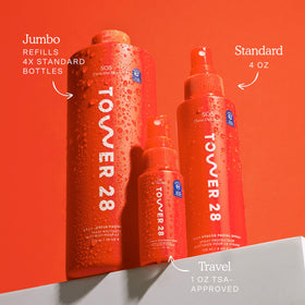 Tower 28 bottle beside a common water bottle highlighting the 16 oz scale