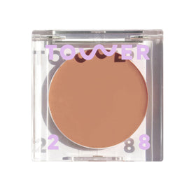 Tower 28 Sculptino compact front view showing neutral matte finish and label benefit