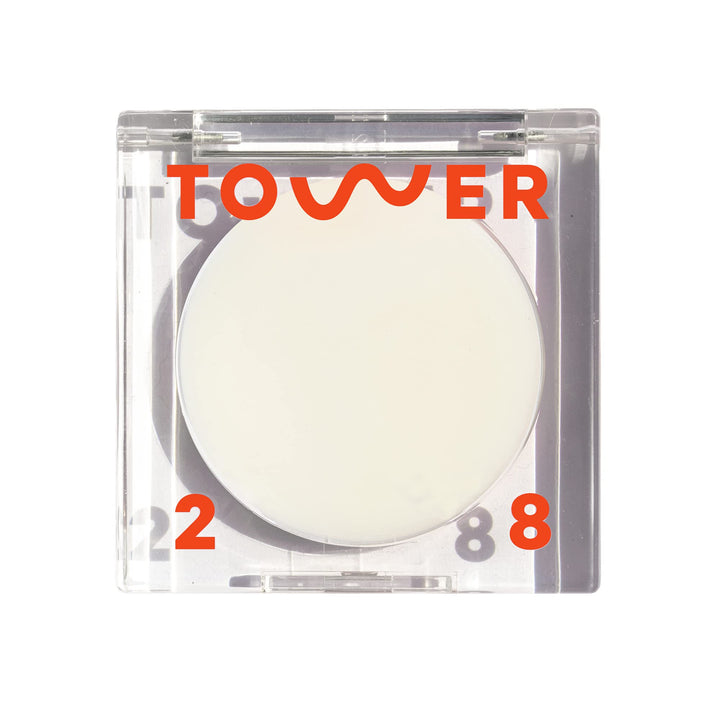 Tower 28 SuperDew front packaging showing compact balm and label, highlights portability
