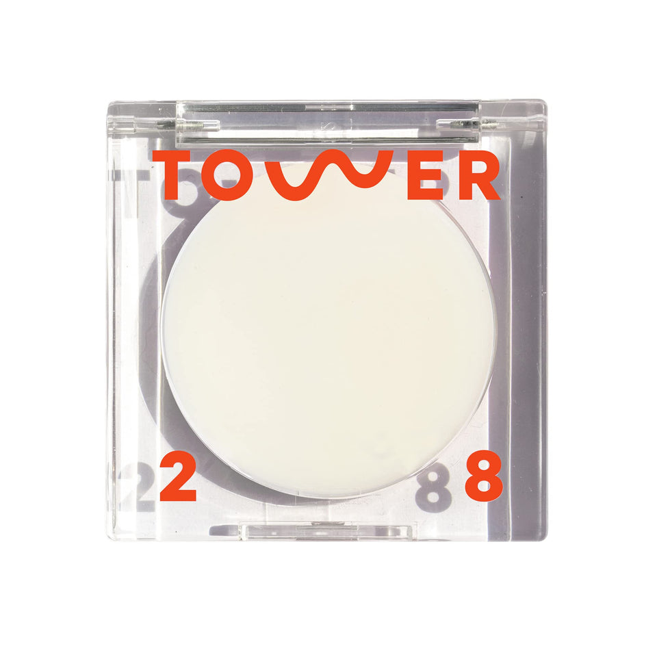 Tower 28 SuperDew front packaging showing compact balm and label, highlights portability