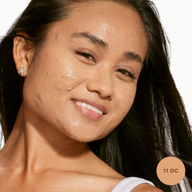 Close-up texture shot of Tower 28 concealer showing creamy hydration and blendability