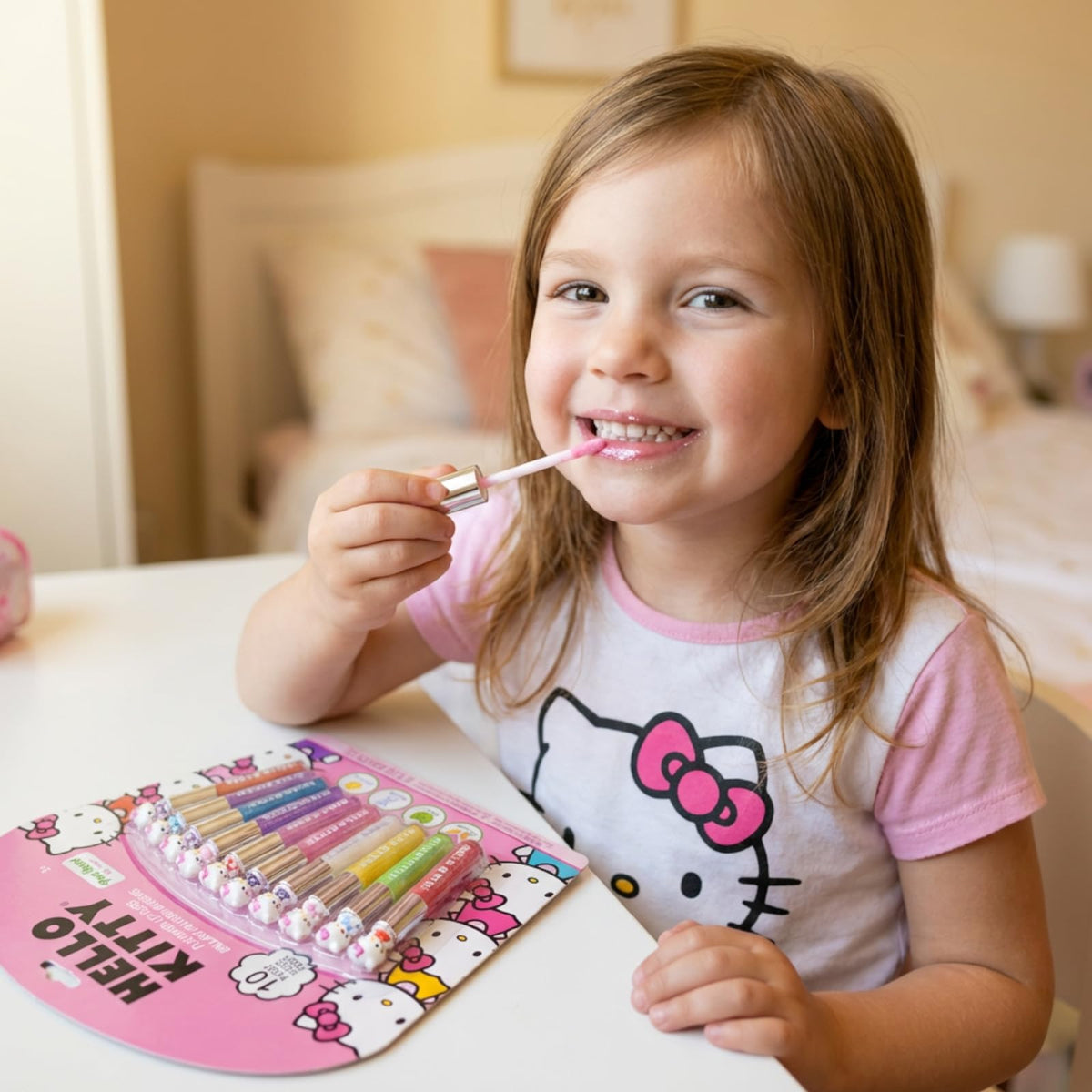 Townley Girl Hello Kitty girl applying gloss lifestyle image showing safe fun and confidence