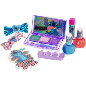 Townley Girl child applying lip gloss while smiling showing safe, playful grooming benefit