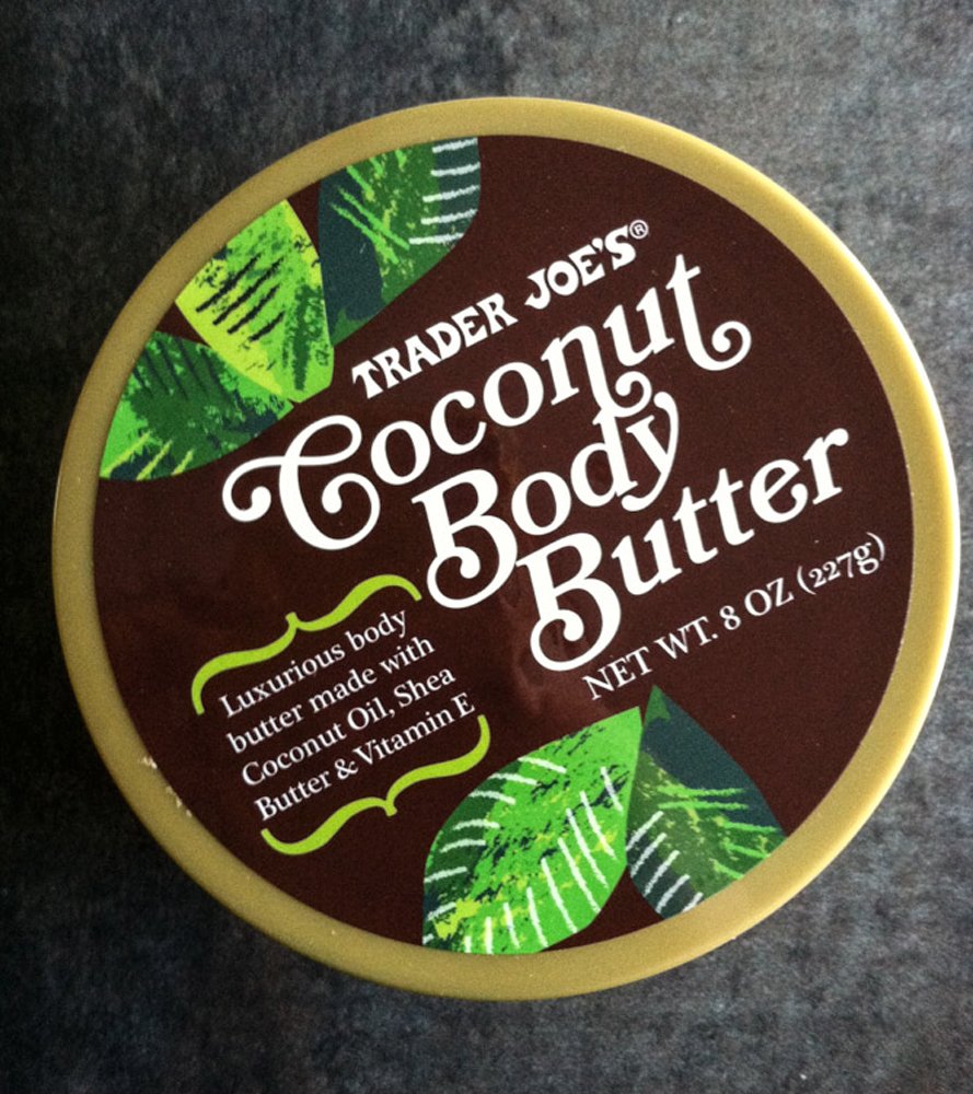 Trader Joe's coconut body butter next to coconut and shea ingredients on shelf, emphasizes natural components