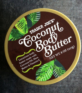 Trader Joe's coconut body butter next to coconut and shea ingredients on shelf, emphasizes natural components