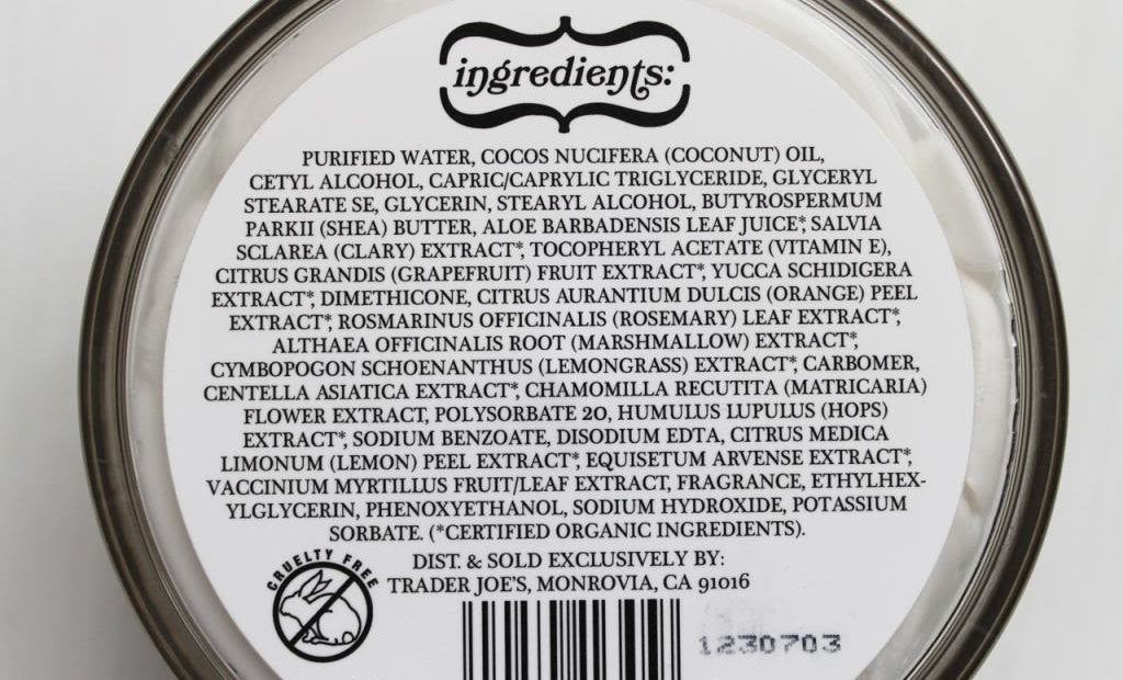 Two Trader Joe's coconut body butter tubs beside everyday items for scale, shows value of 2-pack