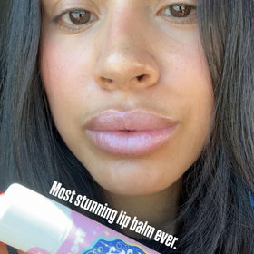 TREAT lip balm swatched on arm showing iridescent shimmer and moisturizing payoff