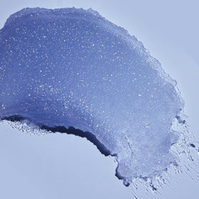 Tree Hut Exotic Bloom scoop on fingers demonstrates easy application benefit
