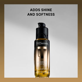 TRESemmé bottle shown next to hand to illustrate compact 1.35 fl oz travel-friendly size