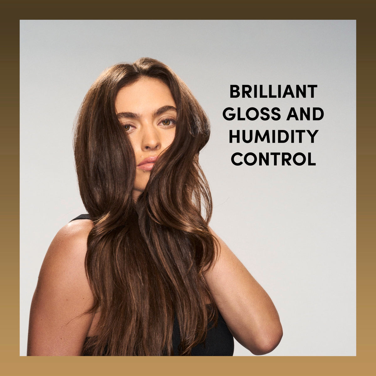 TRESemmé stylist spraying finished hairstyle for polish and flyaway control
