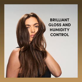 TRESemmé stylist spraying finished hairstyle for polish and flyaway control