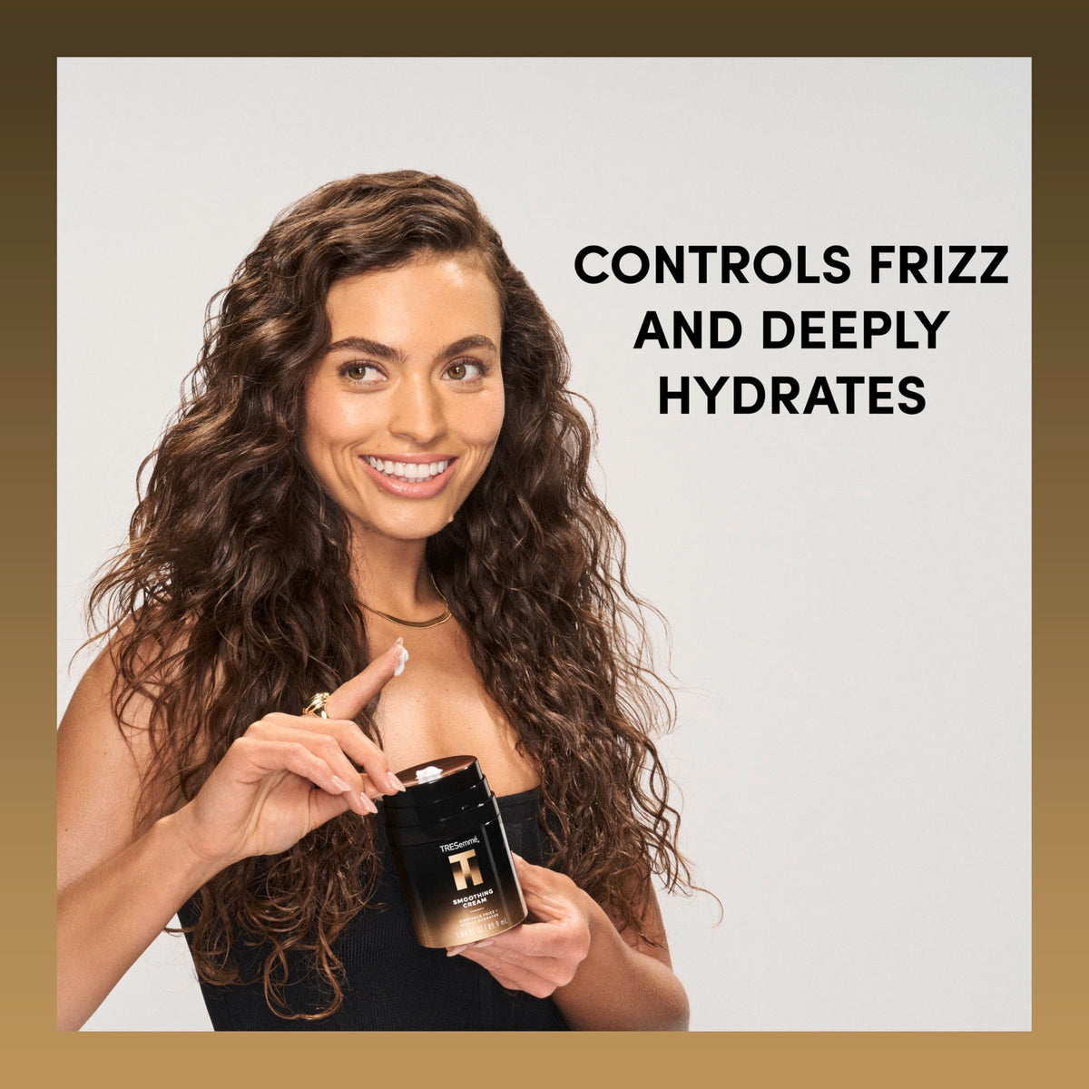 TRESemmé applied to midlengths demonstrating smoother, frizz-controlled hair