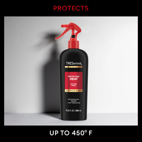 TRESemmé spray in hand applying lightweight protection before styling