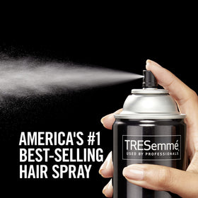 TRESemmé being sprayed on styled hair to set shape and reduce frizz