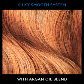 TRESemmé argan oil drops on hair strand closeup, provides frizz control
