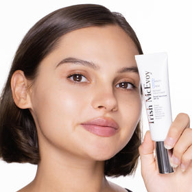 Trish McEvoy next to compact showing 55ml size and travel-friendly benefit