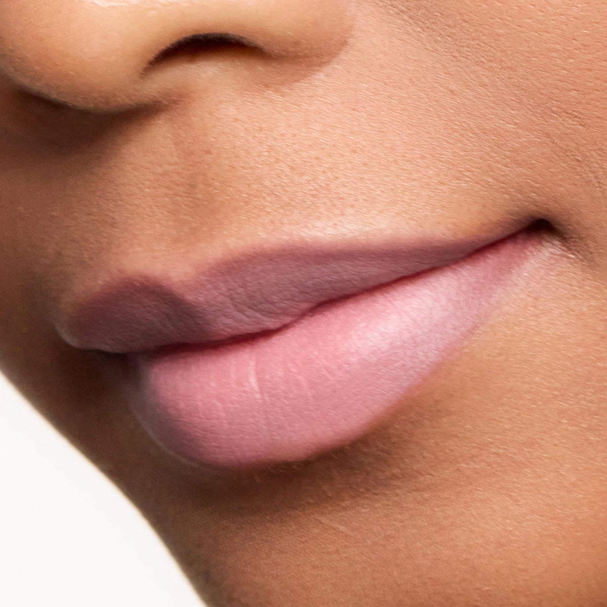 Trish McEvoy Easy Lip Color Dolled Up in a purse showing travel-ready convenience