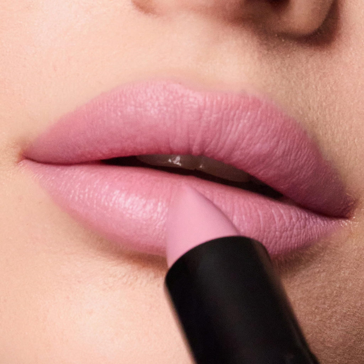 Trish McEvoy Easy Lip Color Dolled Up lip swatch on skin showing sheer pink