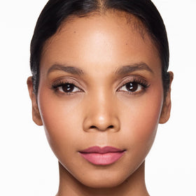 Trish McEvoy lip crayon on model applying shows effortless finish and polished everyday look
