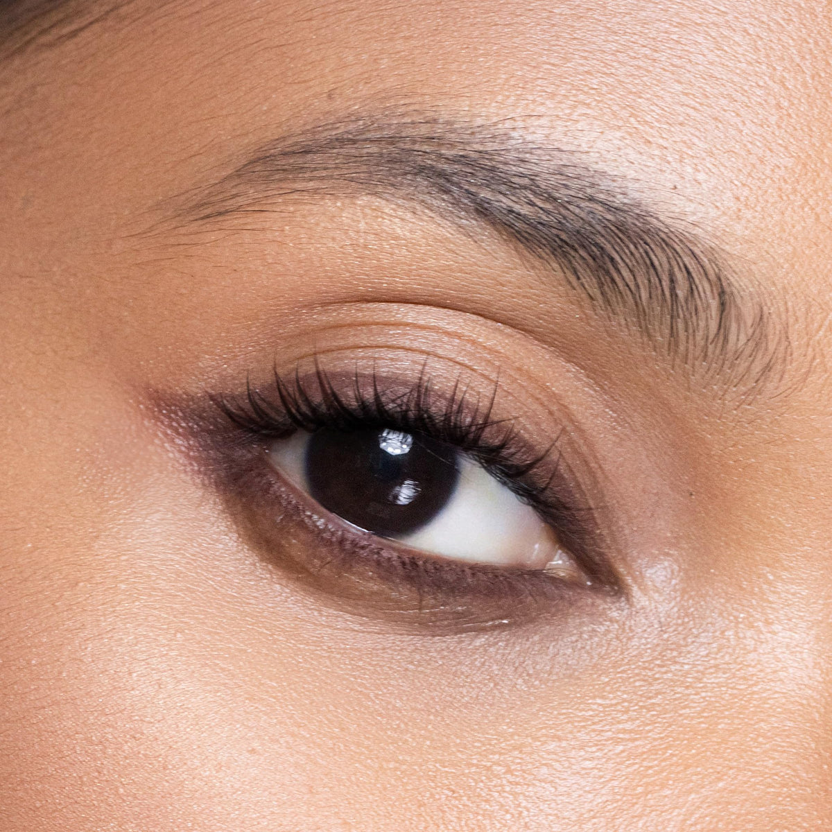 Trish McEvoy eyeliner next to ruler showing compact 1.2 g size for travel convenience