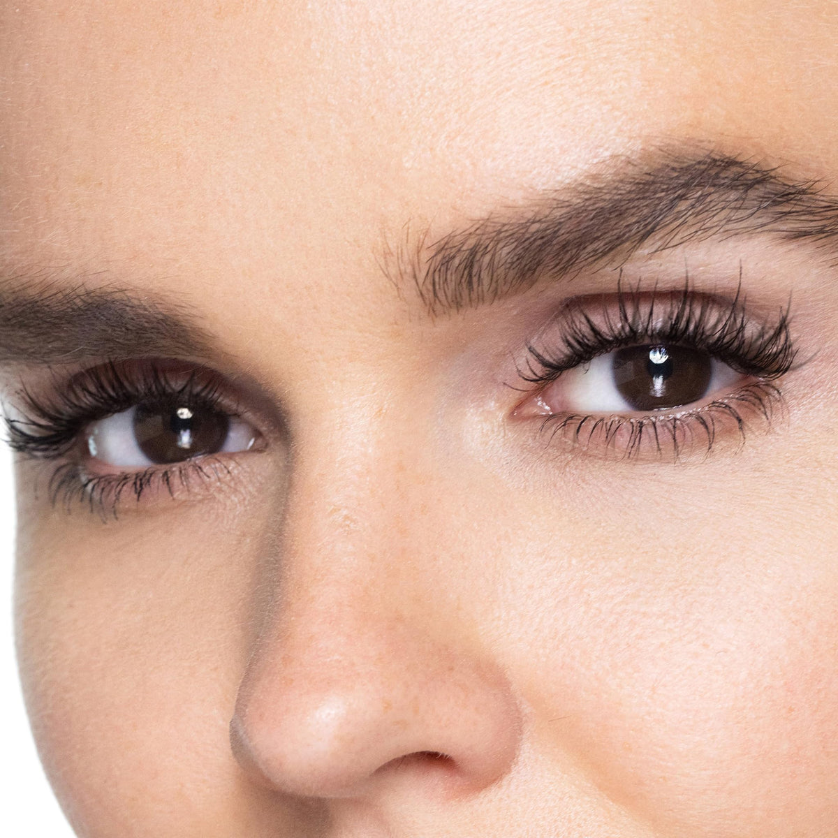 Trish McEvoy mascara being applied in a lifestyle setting for long-wear look