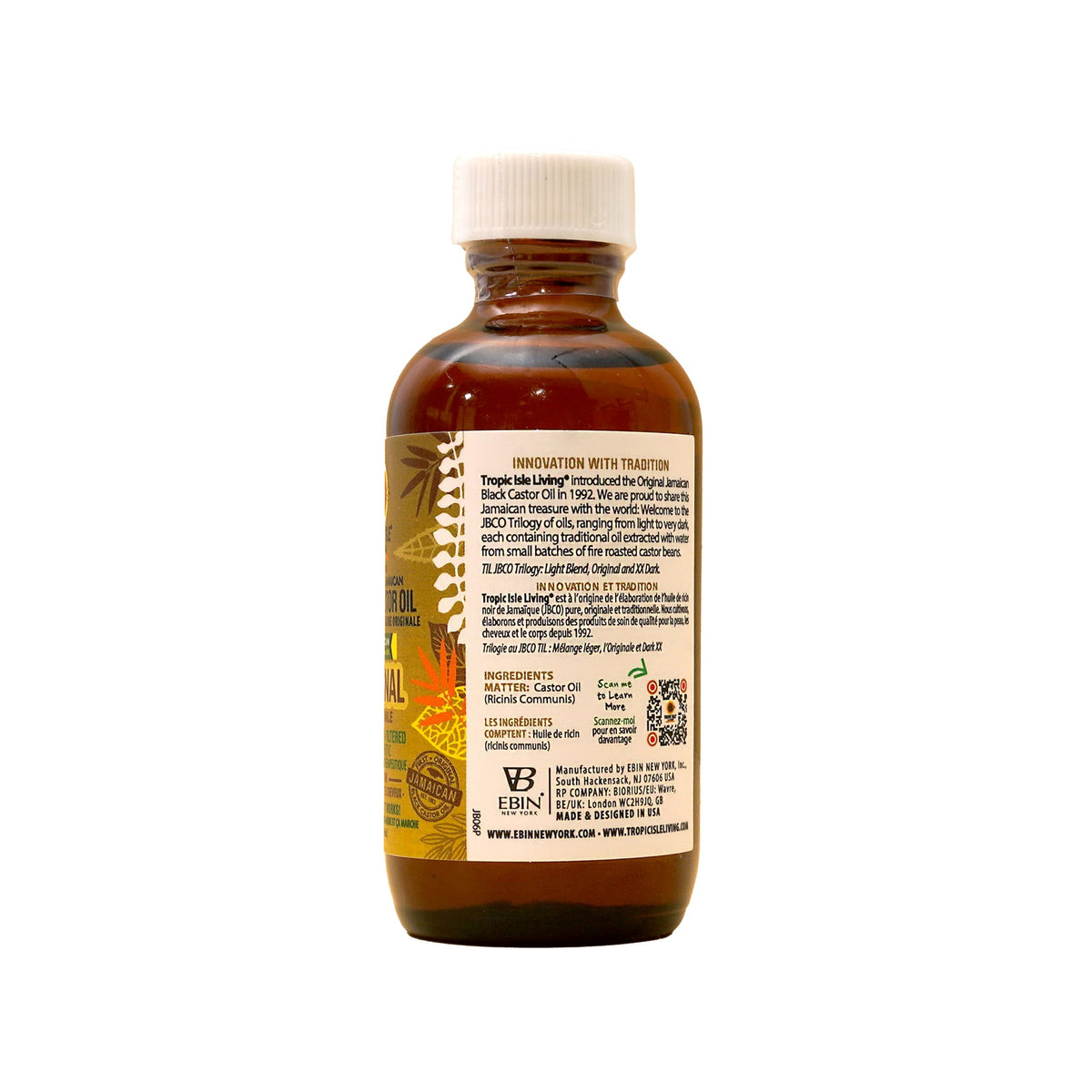 Tropic Isle Living bottle beside coin to show 59ml scale for easy reference